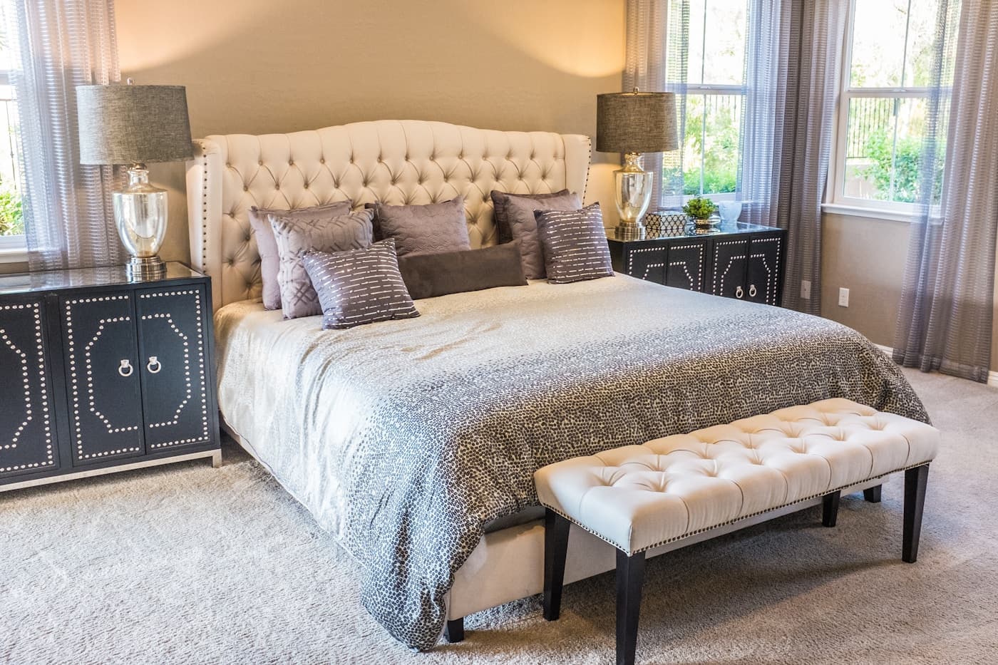 Stylish bedroom with woven chair and wooden side table